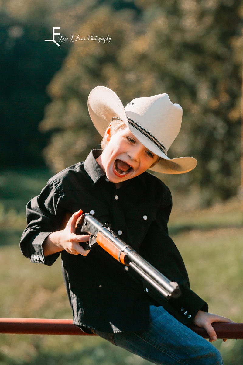 Laze L Farm Photography | Farm Session | Taylorsville NC | silly faces with the gun