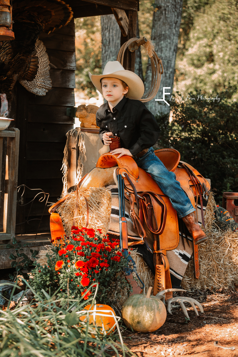 Laze L Farm Photography | Farm Session | Taylorsville NC | sitting on the saddle
