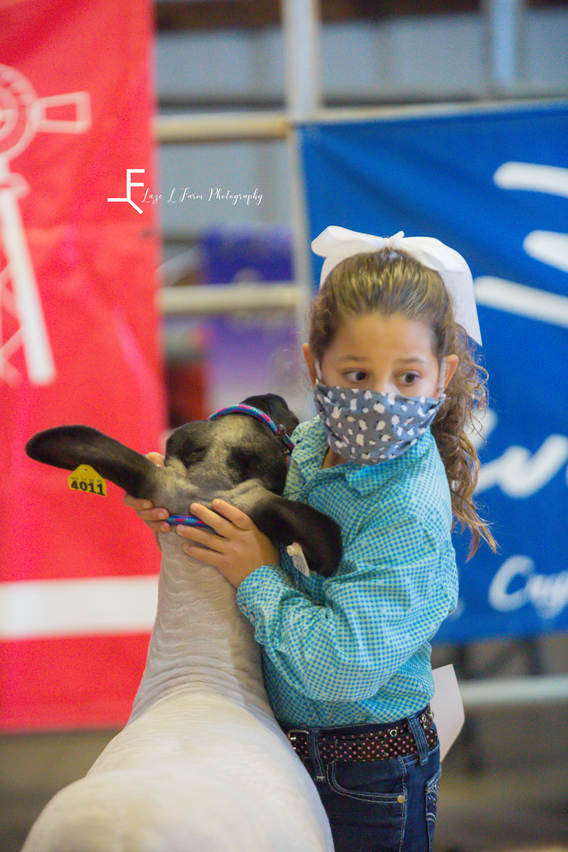 Laze L Farm Photography | Livestock Show | Lenoir NC | close up of little girl posing sheep