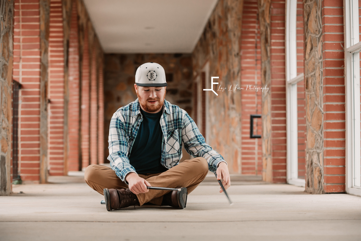 Laze L Farm Photography | Senior Pictures | Taylorsville NC | playing the drums on the ground