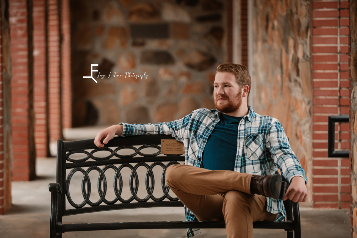 Laze L Farm Photography | Senior Pictures | Taylorsville NC | sitting on a bench looking away 