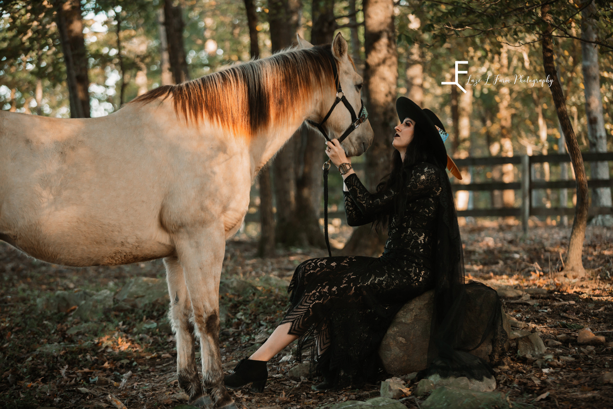 Laze L Farm Photography | Bridal Portraits | Liberty NC | seated pose looking at the horse