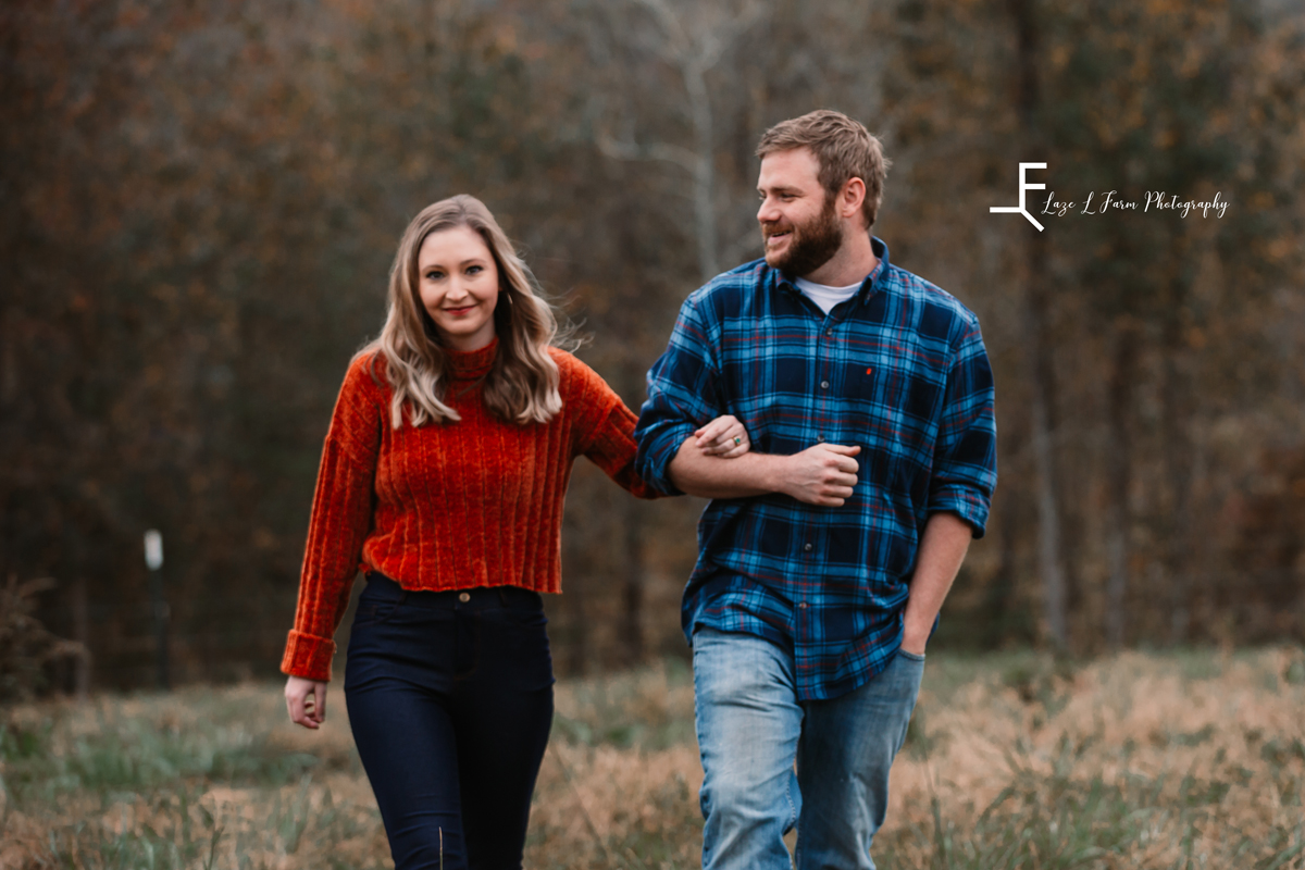 Laze L Farm Photography | Farm Session | Taylorsville NC | younger couple walking together