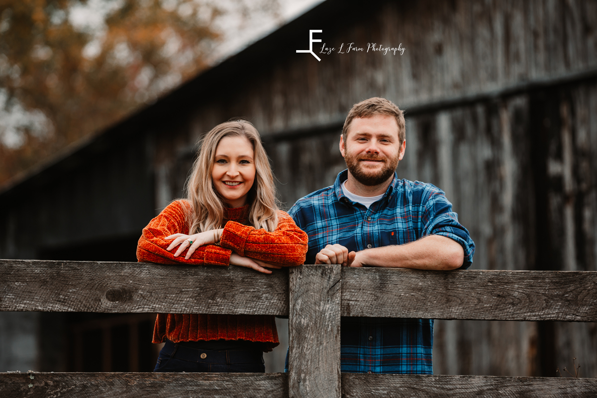 Laze L Farm Photography | Farm Session | Taylorsville NC | younger couple posing on a fence