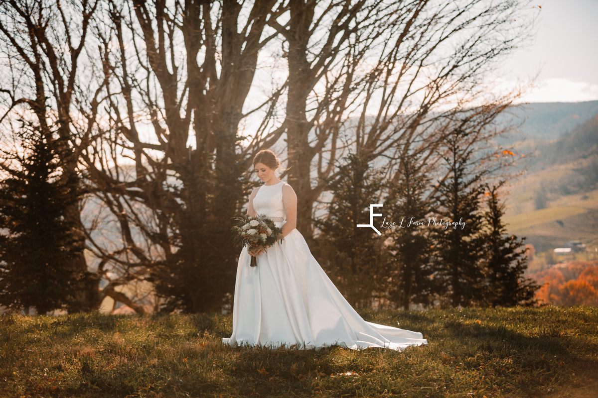 Laze L Farm Photography | Banner Elk NC | The White Crow | Posing bride with her bouquet outside