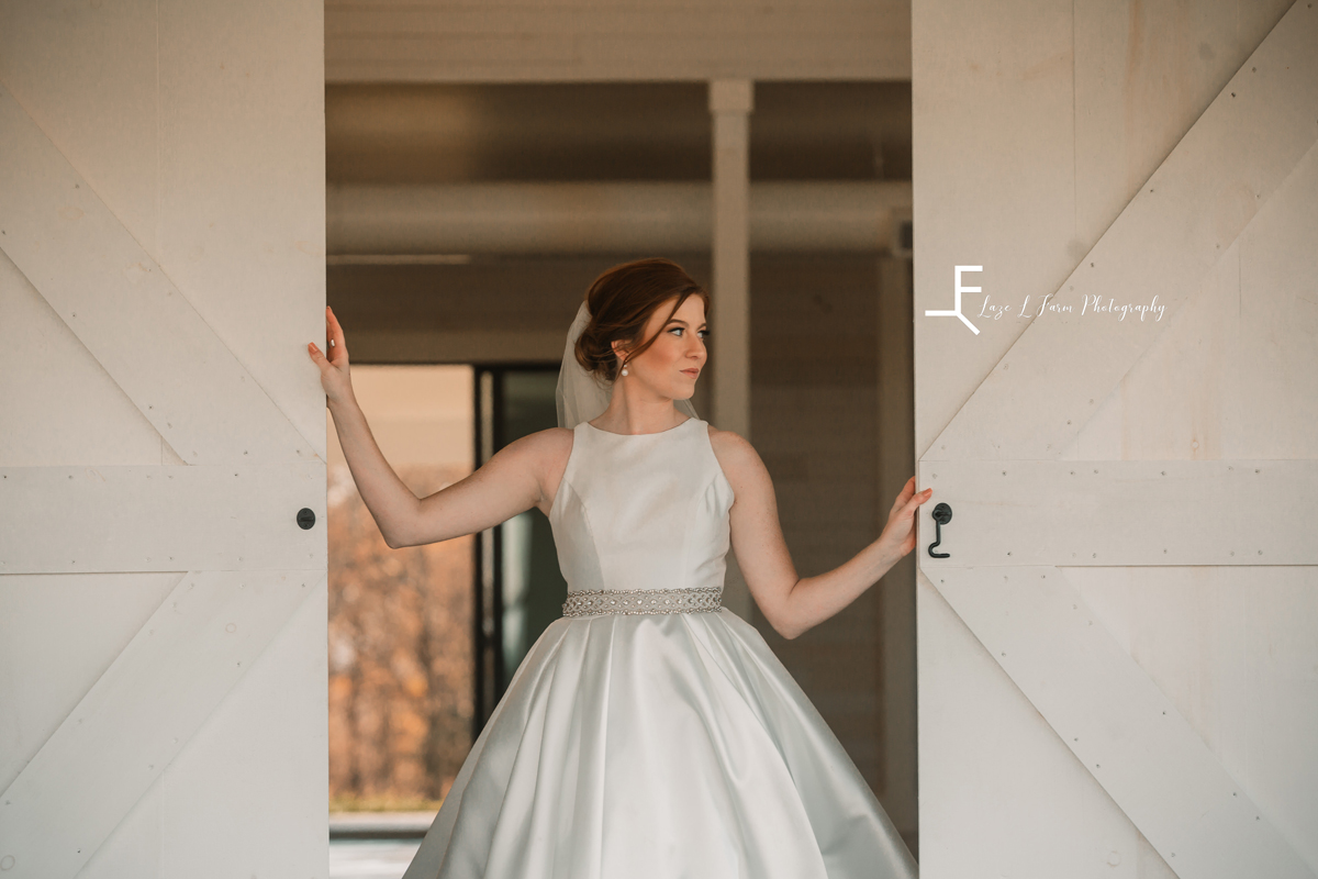 Laze L Farm Photography | Banner Elk NC | The White Crow | bride posing in the doorway of venue