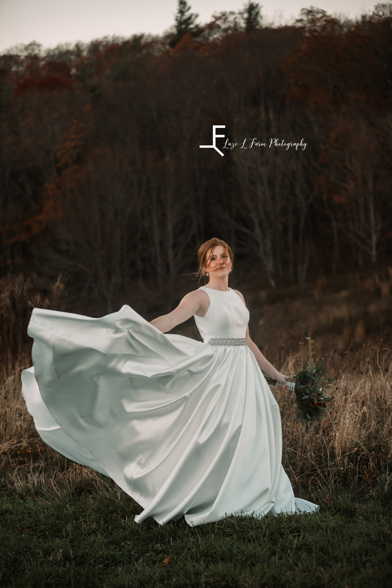 Laze L Farm Photography | Banner Elk NC | The White Crow | twirling the dress in the field