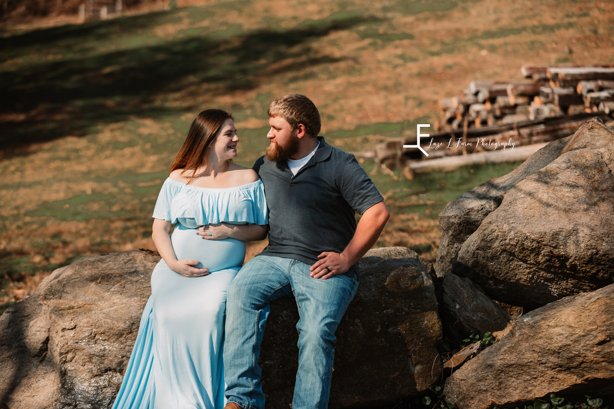 Laze L Farm Photography | Farm Session | Taylorsville NC | looking at each other on the rock