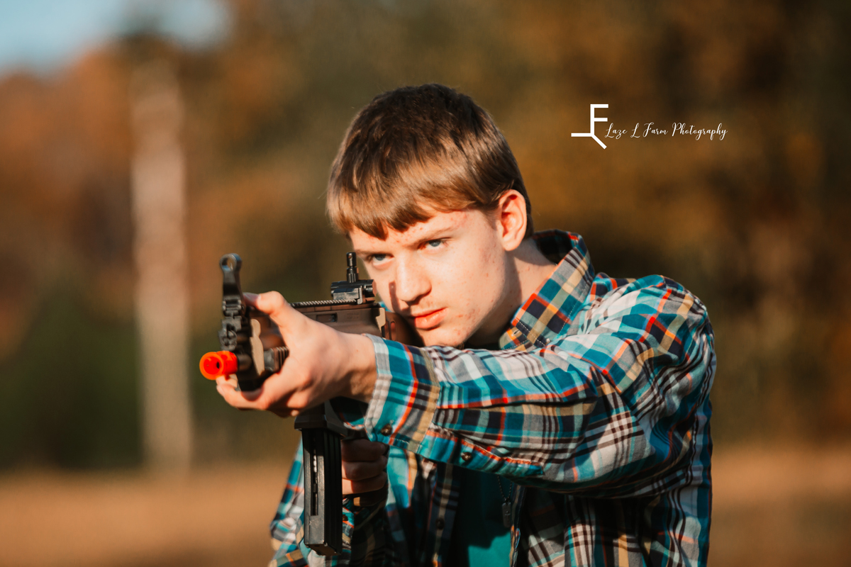 Laze L Farm Photography | Farm Session | Taylorsville NC | son posed with his gun