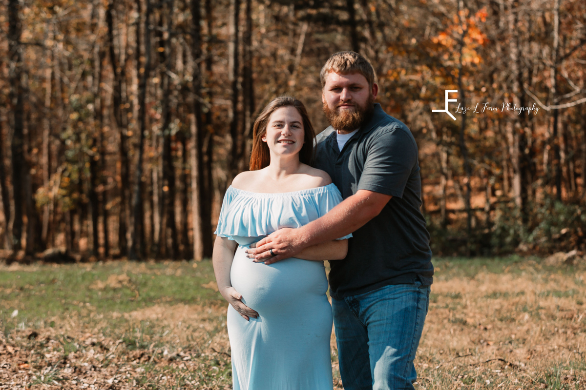 Laze L Farm Photography | Farm Session | Taylorsville NC | parents holding mom's baby bump