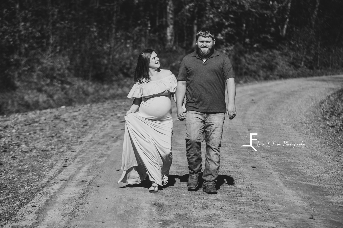 Laze L Farm Photography | Farm Session | Taylorsville NC | black and white couple walking towards camera