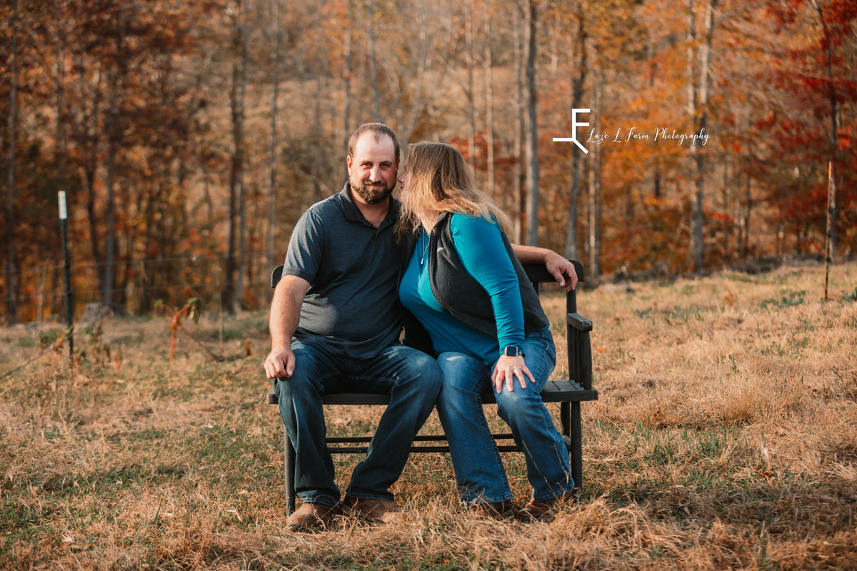 Laze L Farm Photography | Farm Session | Taylorsville NC | seated couple photo, wife kissing husband