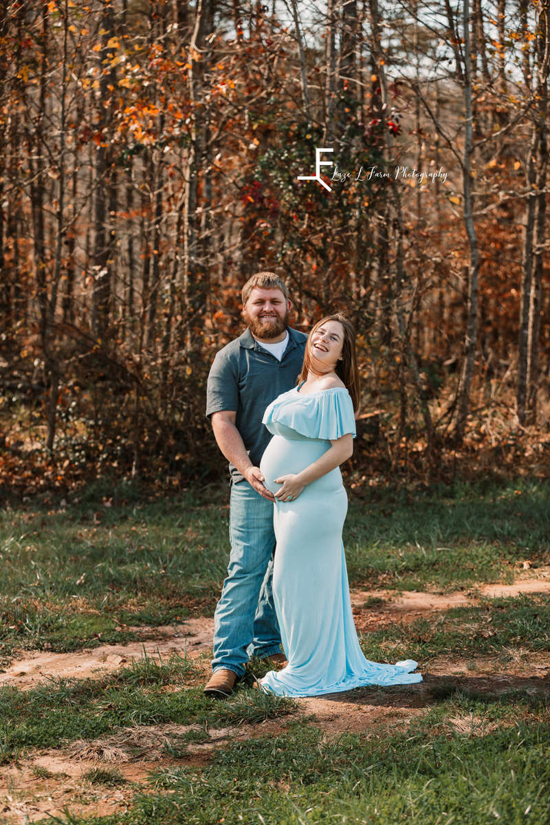 Laze L Farm Photography | Farm Session | Taylorsville NC | couple posed holding her baby bump