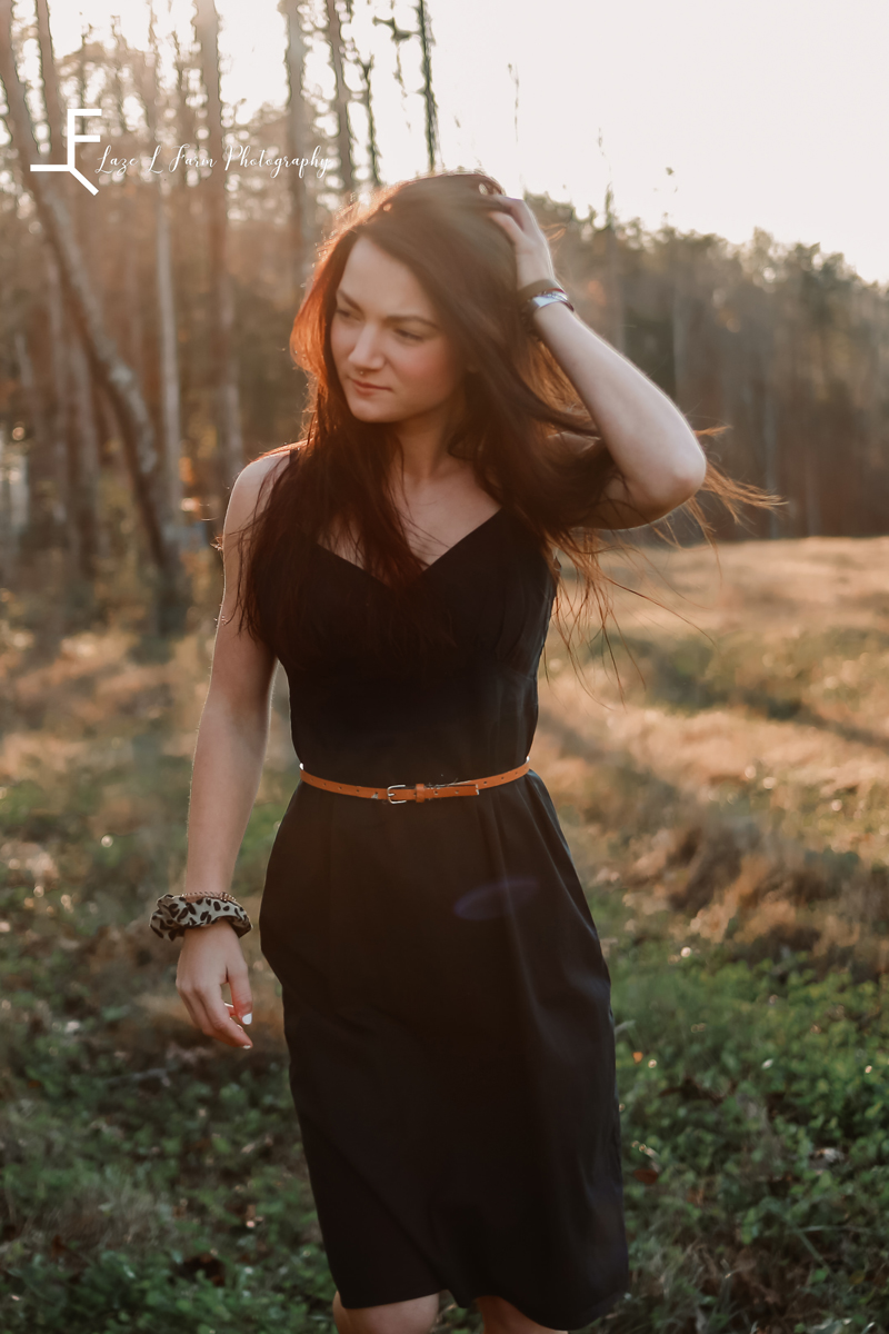 Laze L Farm Photography | Farm Session | Cleveland NC | candid of kelsie walking in the field