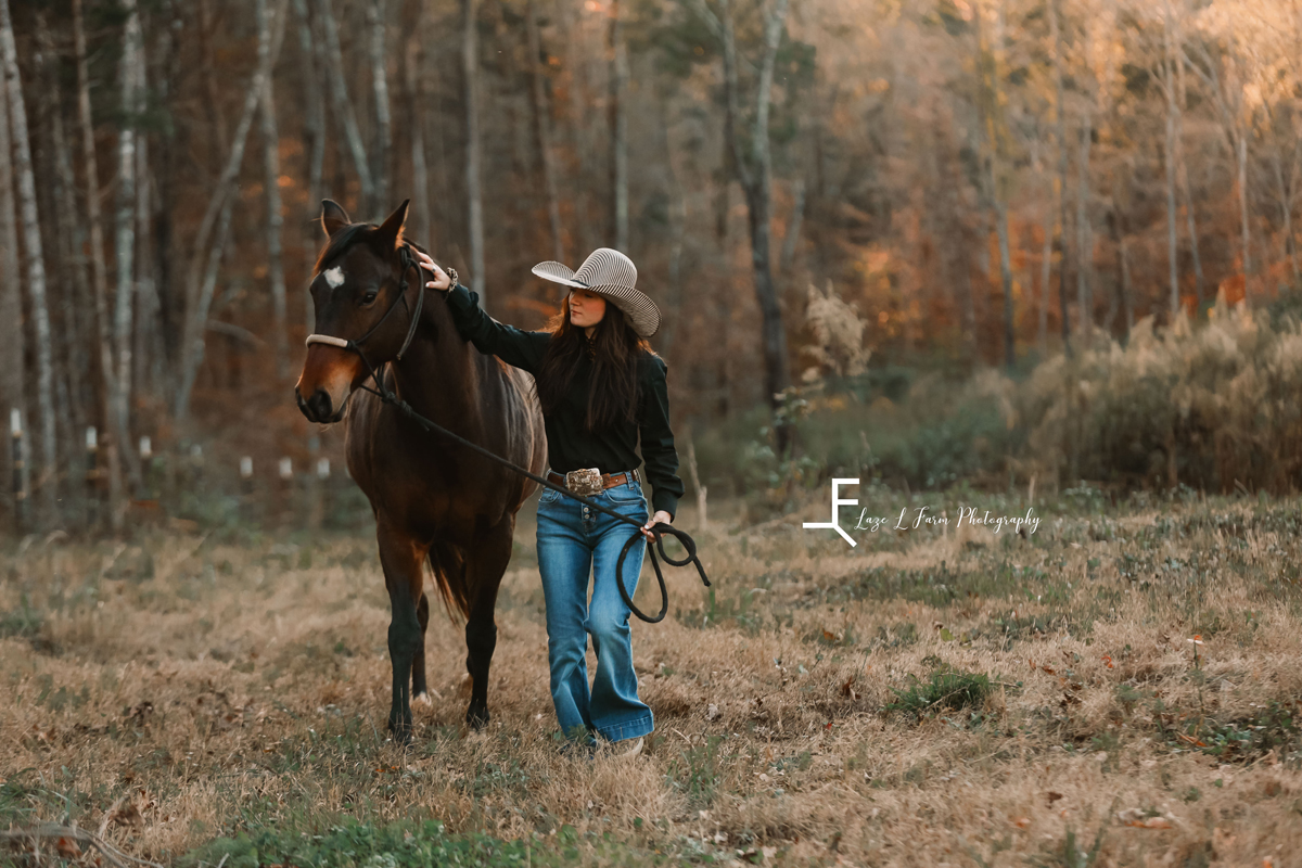 Laze L Farm Photography | Farm Session | Cleveland NC | kelsie candid walking with her horse