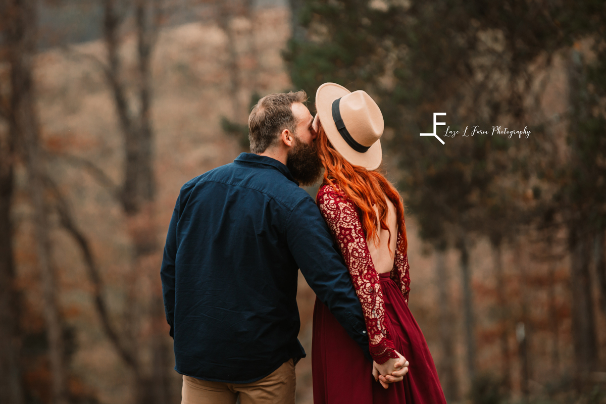 Laze L Farm Photography | Farm Session | Taylorsville NC | couple kissing facing away
