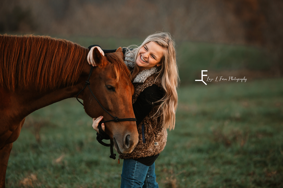 Laze L Farm Photography | Western Lifestyle | Taylorsville NC | candid of anna laughing with horse