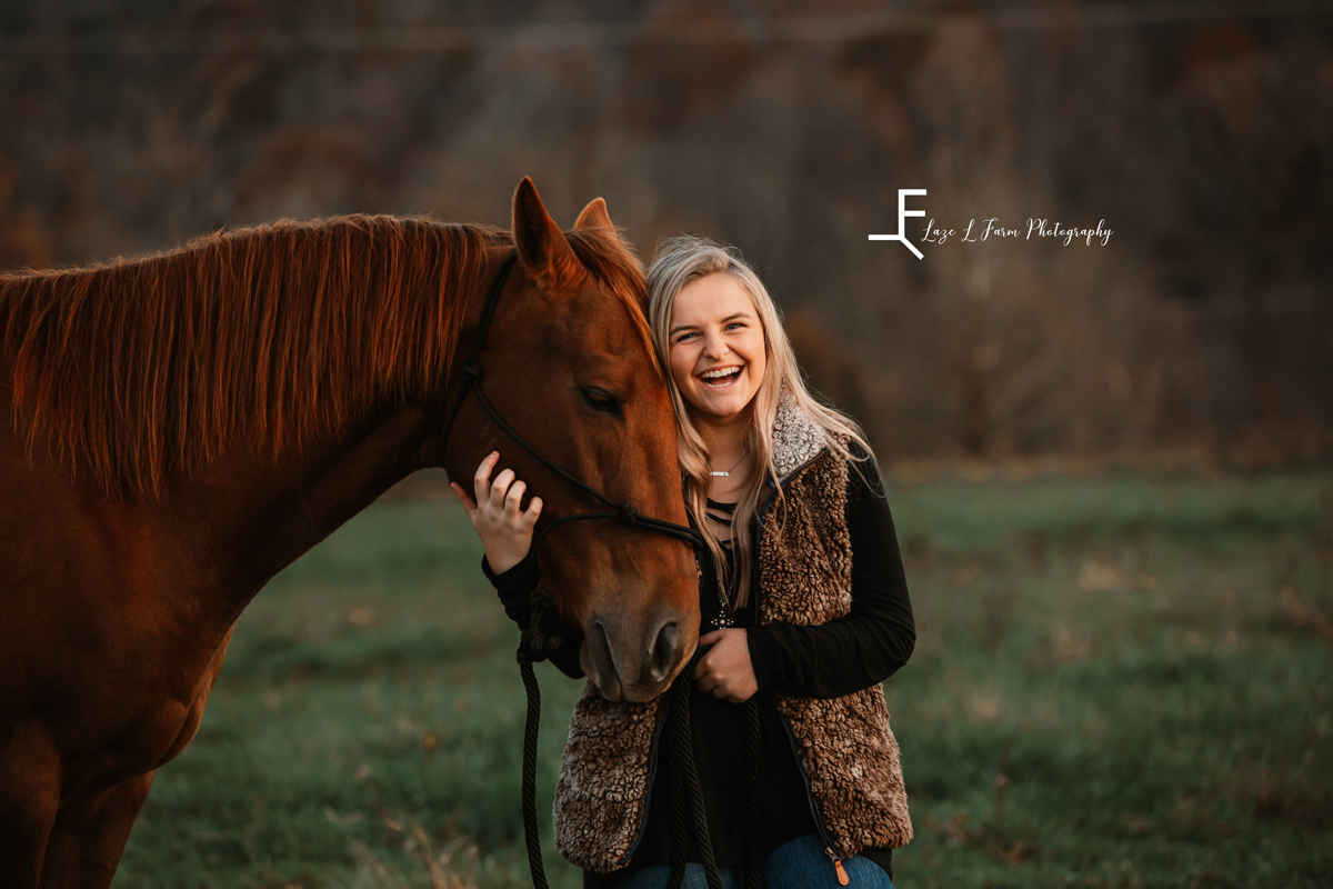 Laze L Farm Photography | Western Lifestyle | Taylorsville NC | candid of anna laughing with her horse