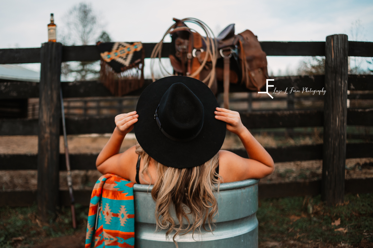 Laze L Farm Photography | Beth dutton | Water Trough | Taylorsville NC | posing her hat