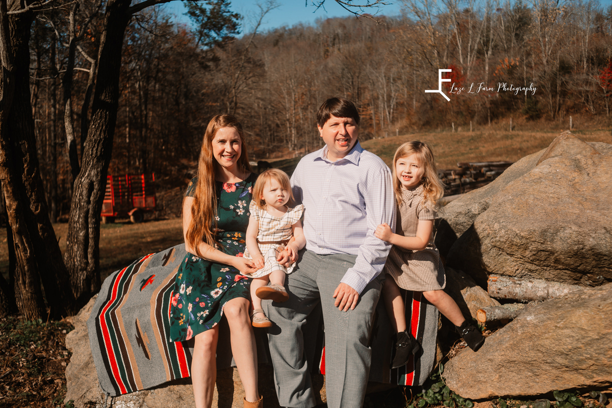 Laze L Farm Photography | Farm Session | Taylorsville NC | Family posed sitting on the rock