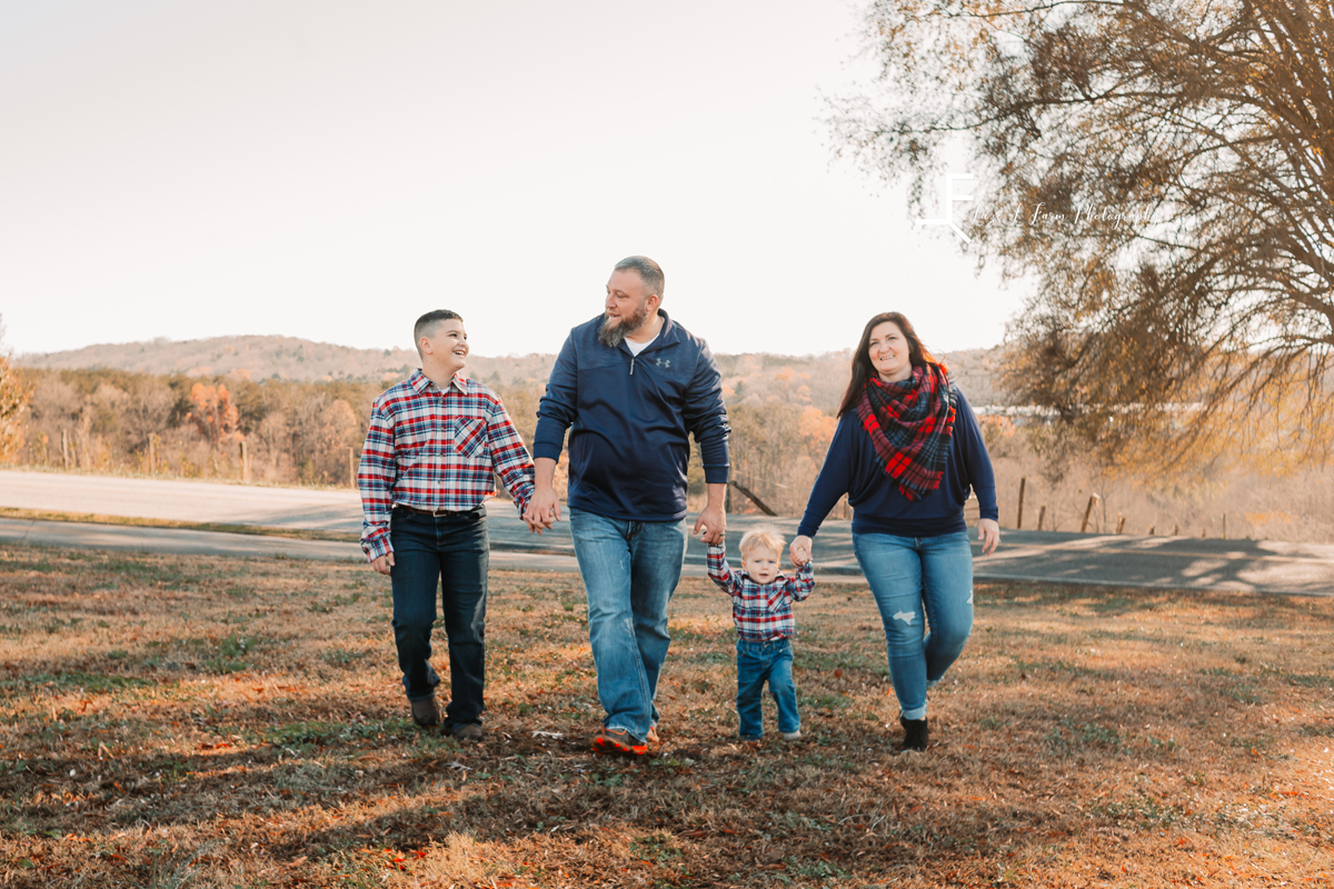 Laze L Farm Photography | Farm Session | Taylorsville NC | family holding hands and walking towards camera