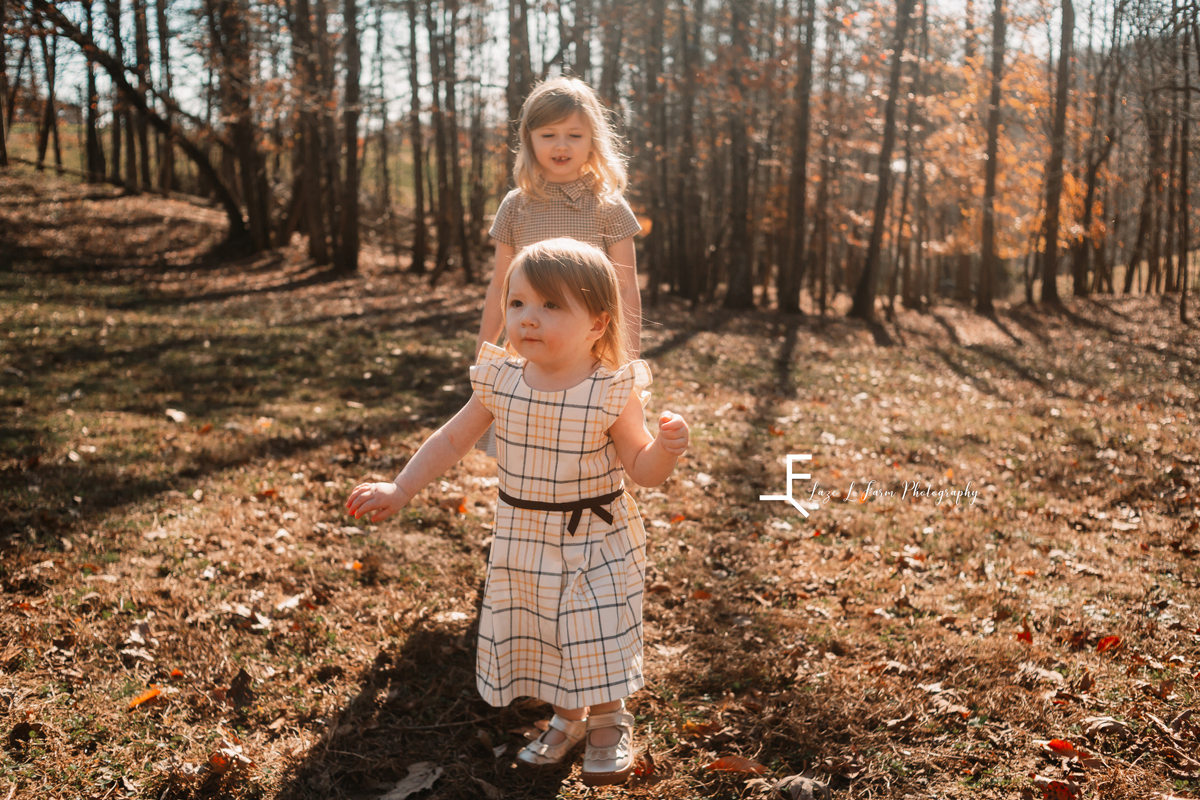 Laze L Farm Photography | Farm Session | Taylorsville NC | two sisters playing