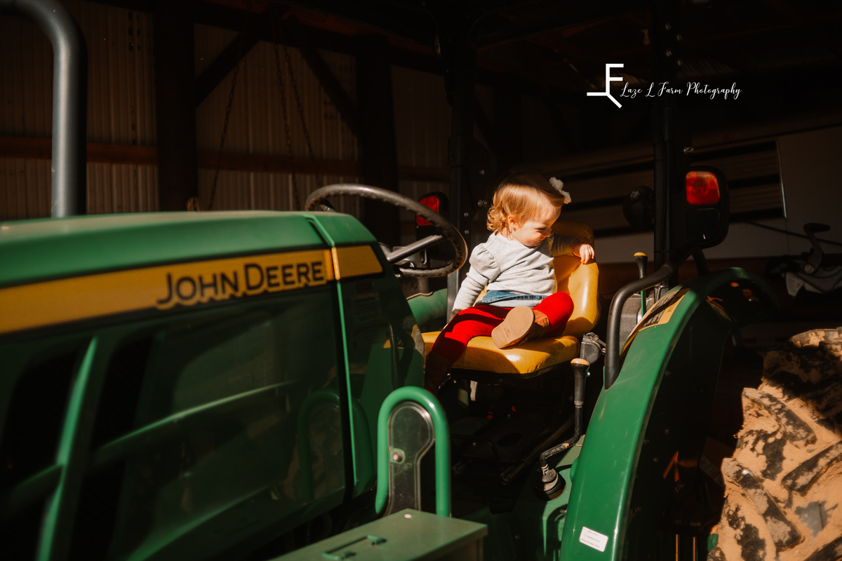 Laze L Farm Photography | Farm Session | Taylorsville NC | candid daughter playing on tractor