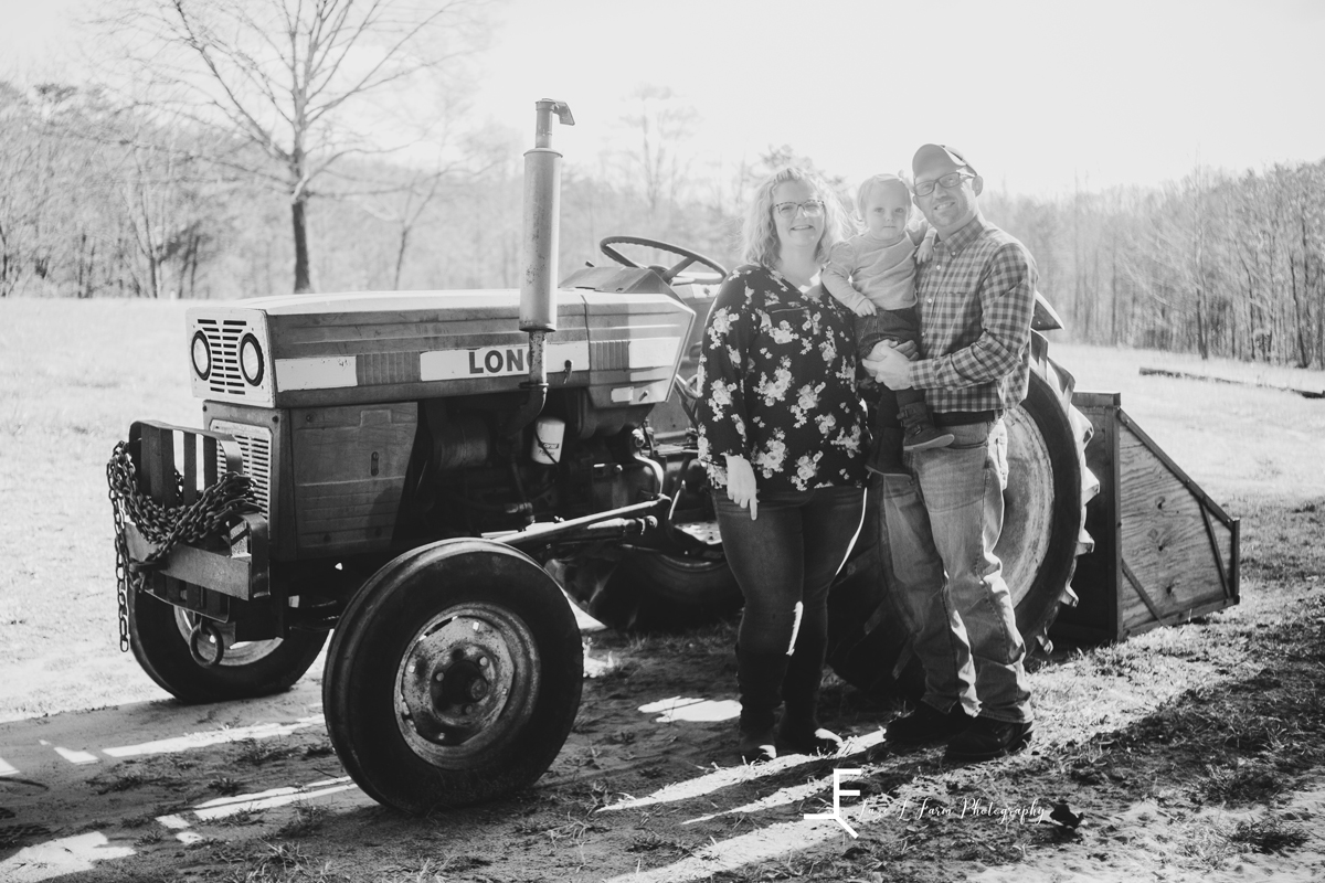 Laze L Farm Photography | Farm Session | Taylorsville NC | black and white family posed by tractor