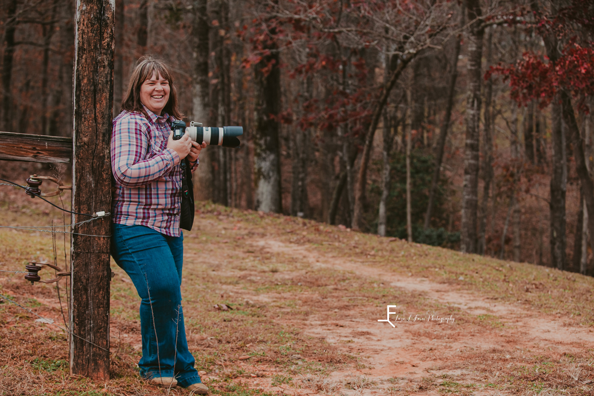 Laze L Farm Photography | Head Shots | Taylorsville NC | standing against a tree holding camera