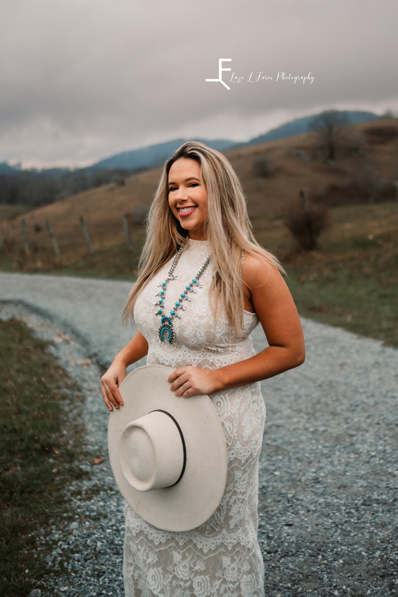 Laze L Farm Photography | Western Lifestyle | Blowing Rock NC | holding the hat, white dress