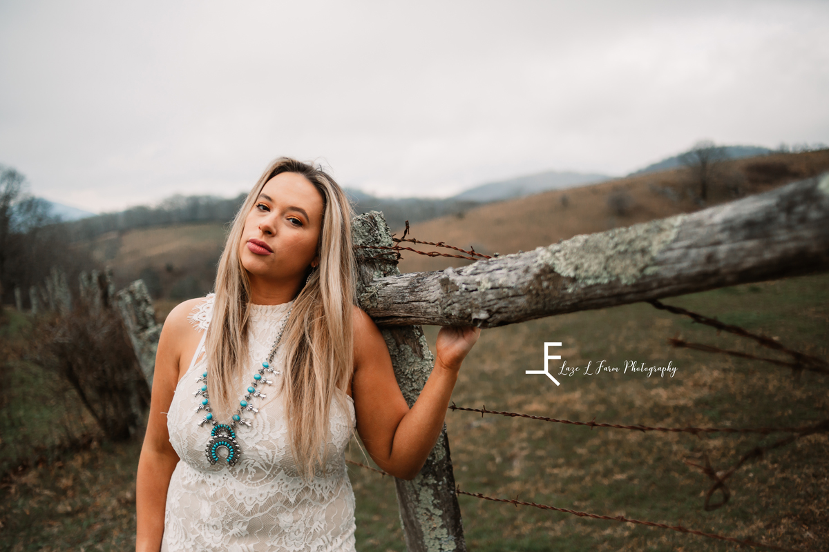 Laze L Farm Photography | Western Lifestyle | Blowing Rock NC | posing against a fence