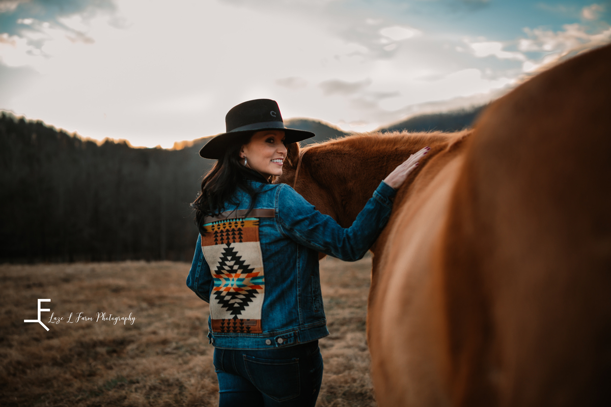 Laze L Farm Photography | Western Lifestyle | Taylorsville NC | smiling back at the camera petting horse