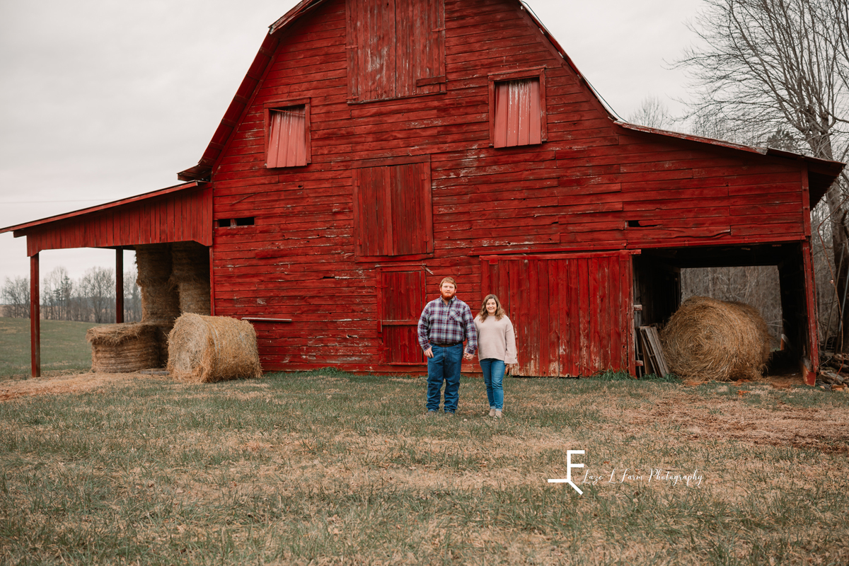 Laze L Farm Photography | Engagement Session | Taylorsville NC | standing in front of the barn