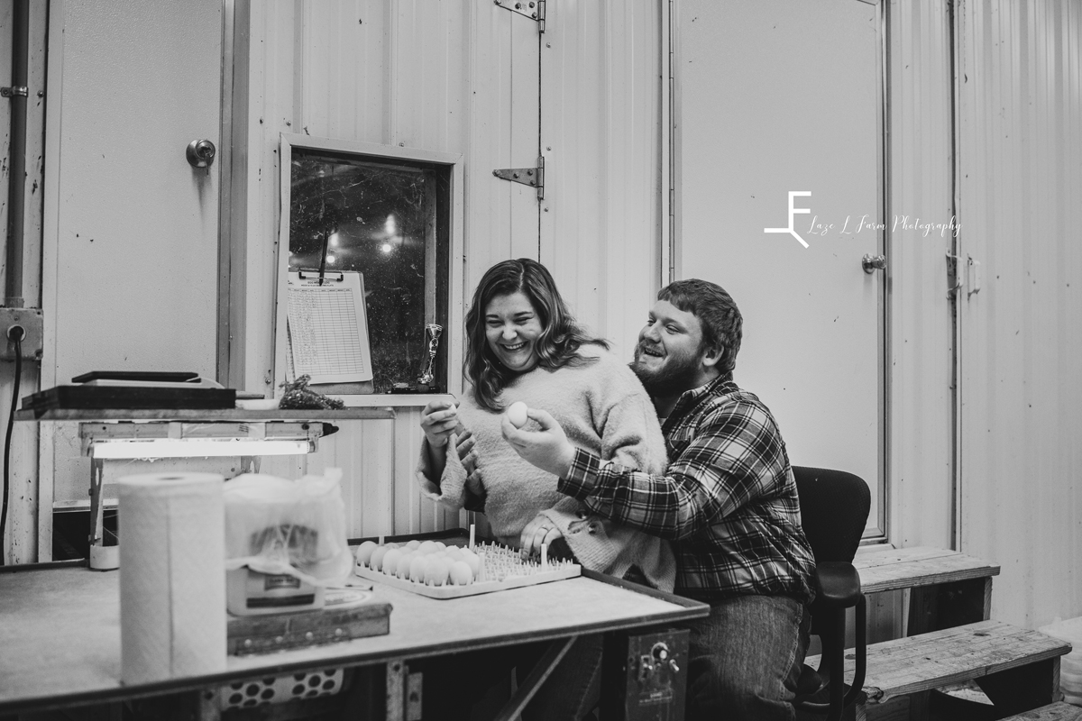 Laze L Farm Photography | Engagement Session | Taylorsville NC | black and white of her sitting on his lap