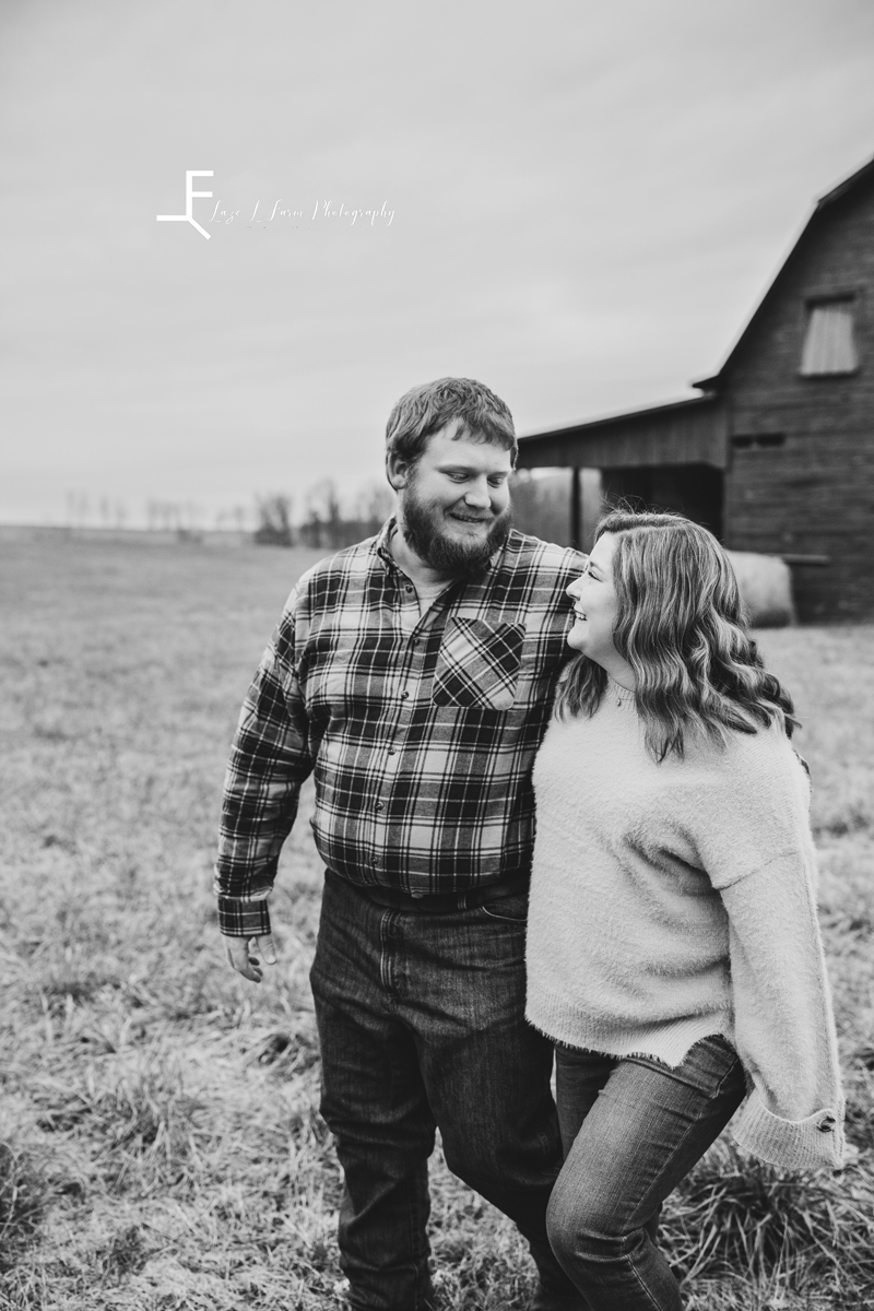 Laze L Farm Photography | Engagement Session | Taylorsville NC | black and white candid smiling at each other