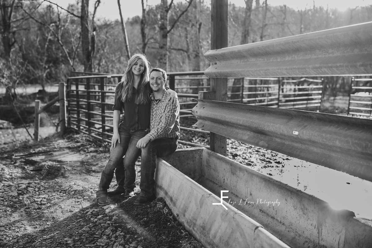 Laze L Farm Photography | Engagement Session | Taylorsville NC | black and white posed on the fence