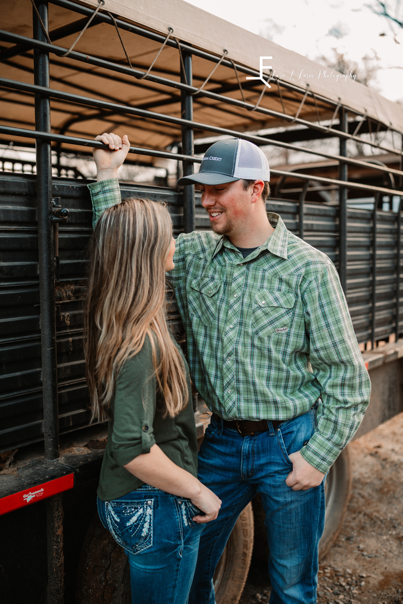 Laze L Farm Photography | Engagement Session | Taylorsville NC | posed against the fence