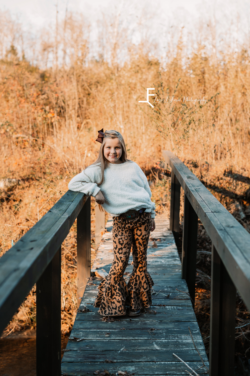 Laze L Farm Photography | Farm Session | Lenoir NC | daughter posing on a bridge