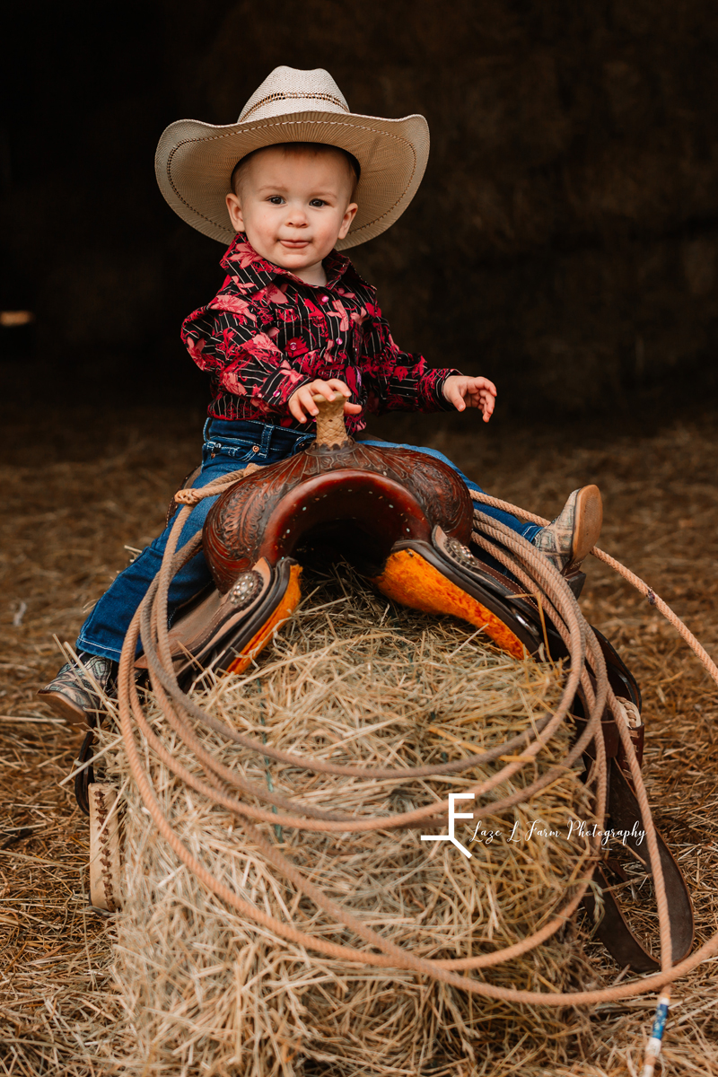  Laze L Farm Photography | Farm Session | Taylorsville NC | lyza posing on the saddle