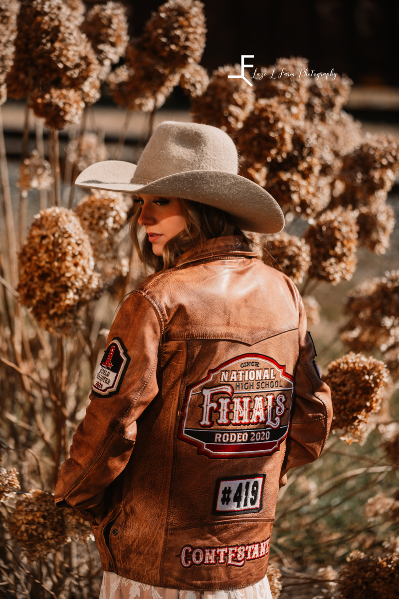 Laze L Farm Photography | Western Lifestyle | Elkin NC | posing the jacket in front of the plants