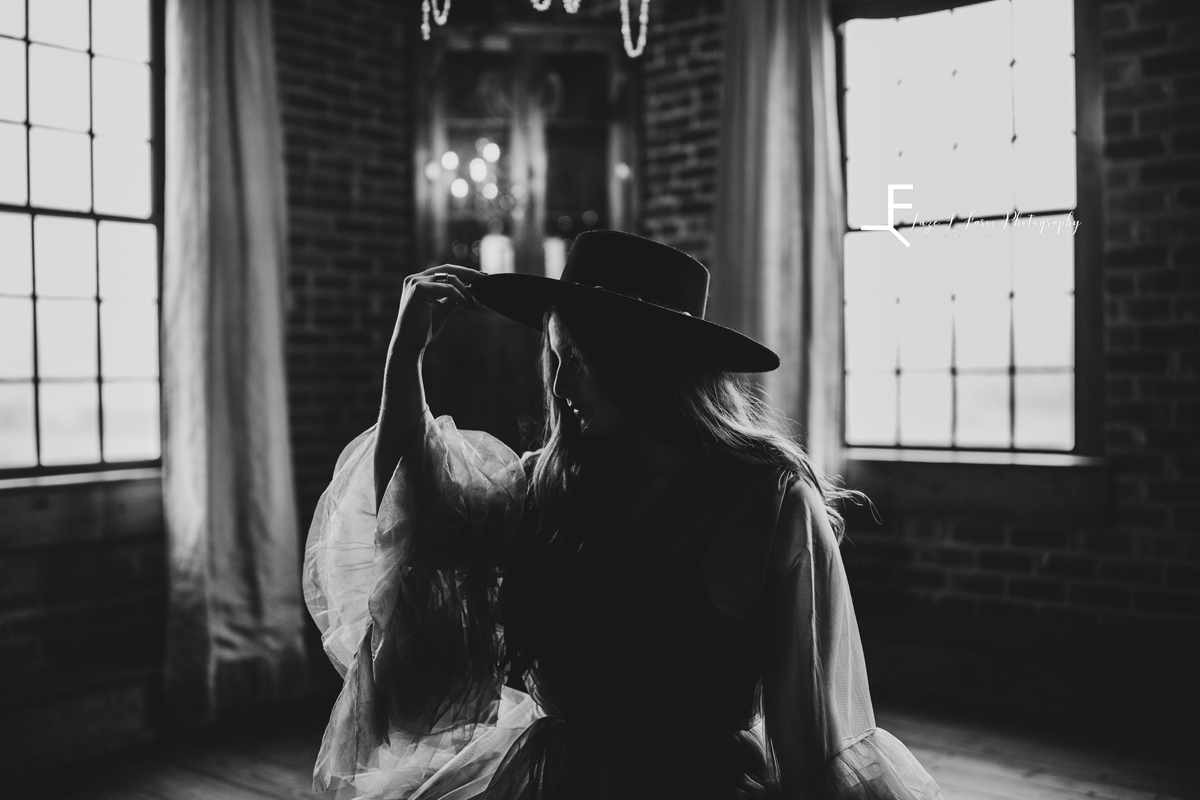 Laze L Farm Photography | Western Lifestyle | Elkin NC | black and white tipping hat in ballroom