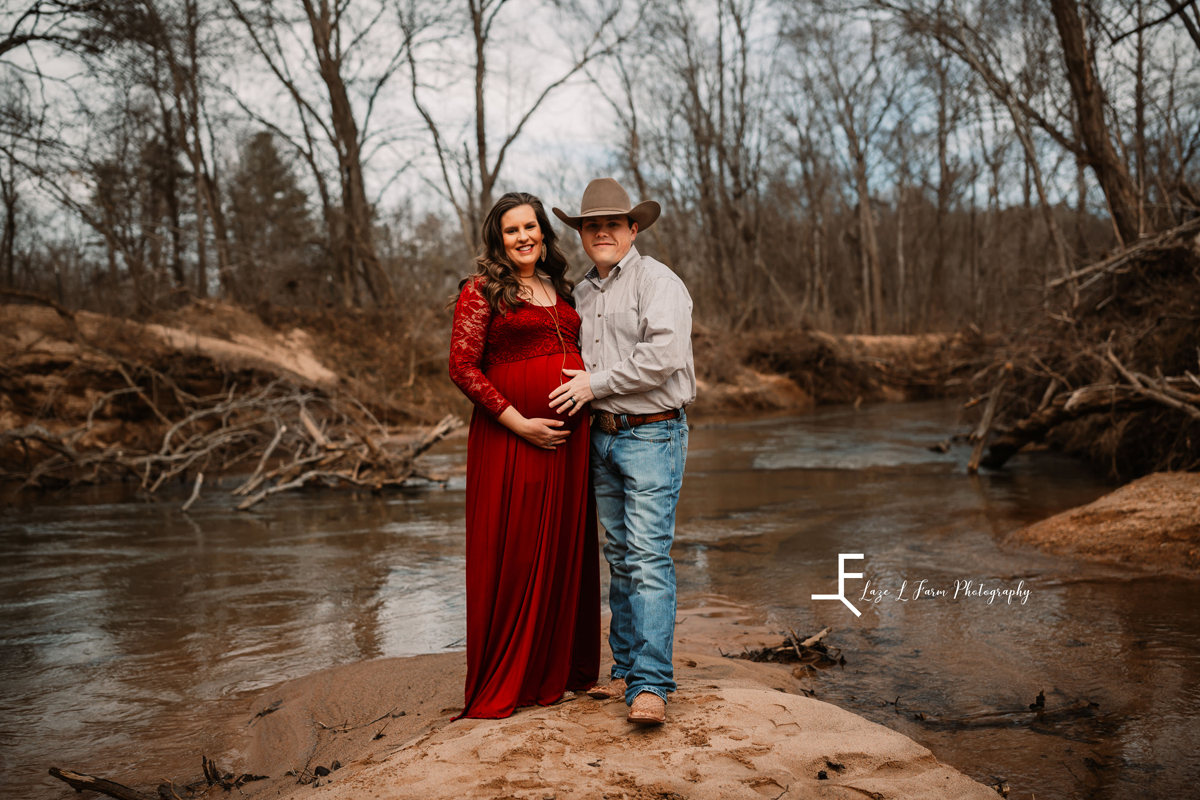 Laze L Farm Photography | Equine Maternity Session | Bethlehem NC | couple posing in front of the water