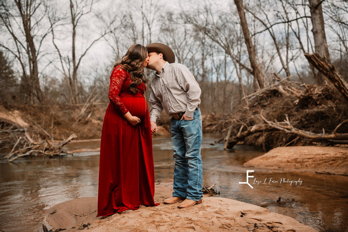Laze L Farm Photography | Equine Maternity Session | Bethlehem NC | couple standing and kissing