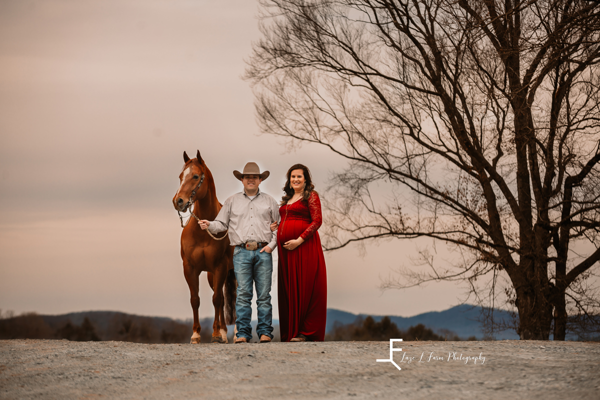 Laze L Farm Photography | Equine Maternity Session | Bethlehem NC | couple standing with horse