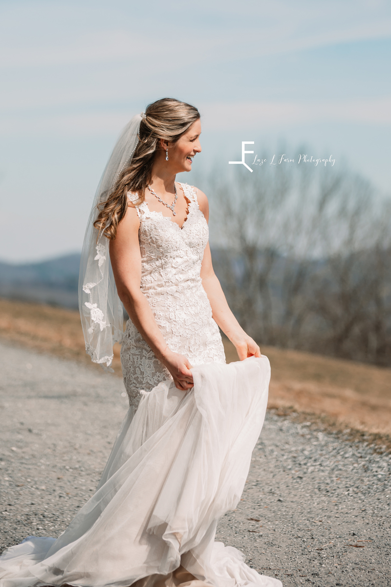 Laze L Farm Photography | Bridal Pictures | Moses Cone - Blowing Rock NC | twirling her dress outside