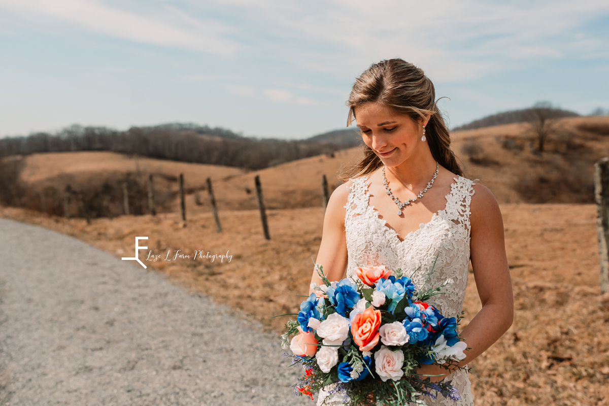 Laze L Farm Photography | Bridal Pictures | Moses Cone - Blowing Rock NC | bride looking down at her flowers