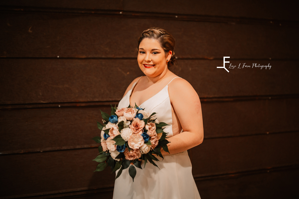 Laze L Farm Photography | Bridal Session | The Emerald Hill | close up of bride standing against a dark wall