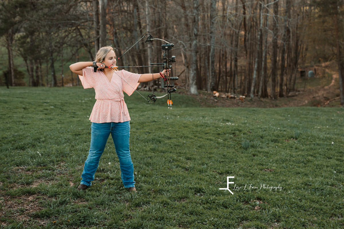Laze L Farm Photography | College Graduation Pictures | Taylorsville NC | posed pulling the bow back