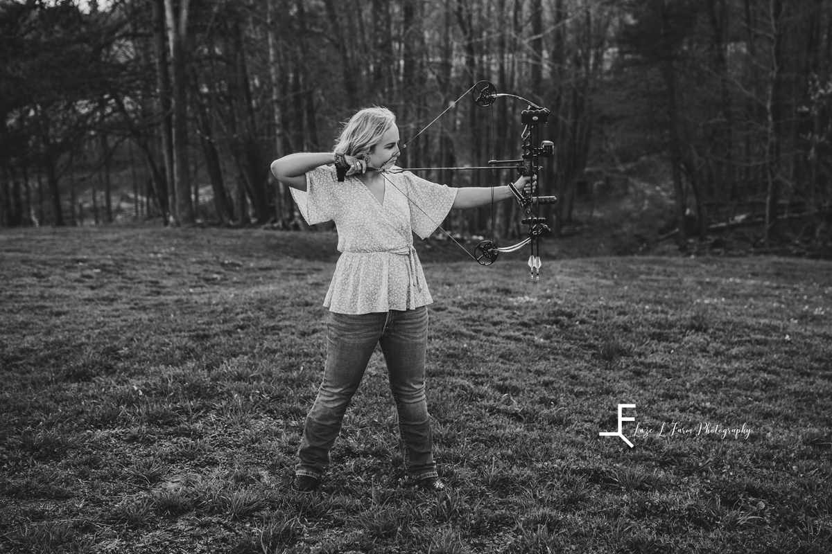 Laze L Farm Photography | College Graduation Pictures | Taylorsville NC | black and white pulling the bow back