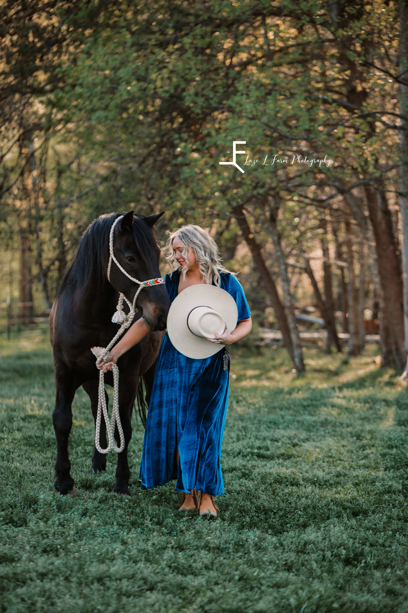 Laze L Farm Photography |Senior Pictures | Taylorsville NC | holding her hat and lead rope